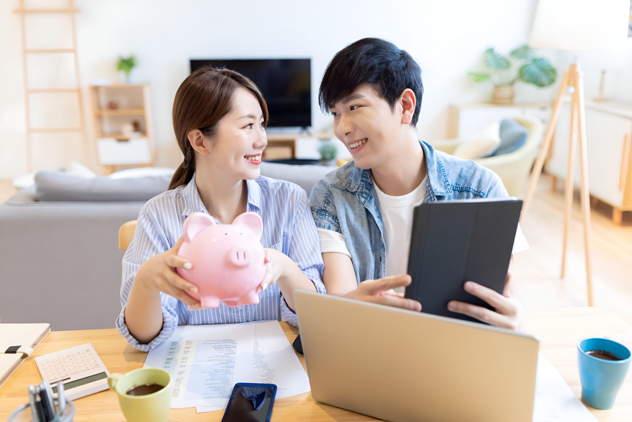 Couple Show Their Piggy Bank